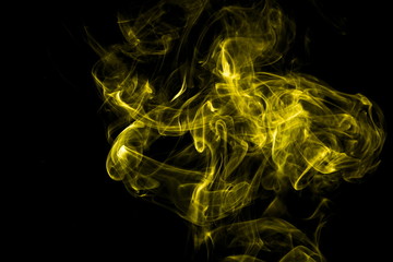 Fototapeta premium Yellow smoke on black background