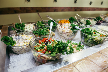 Greek food background. Greek salad, assortment of feta, olives and vegetables. Traditional greek dishes set.