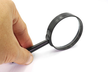 Hand holding Magniflying glass isolated on white background.