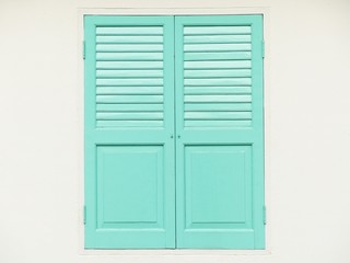 blue wood window on white wall