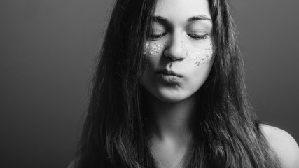 Young woman portrait. Let me think. Uncertainty. Black and white headshot. Copy space.
