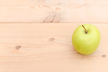 green apple on old wooden rustic table. Useful fruits on wooden background. Top view with copy space. health concept