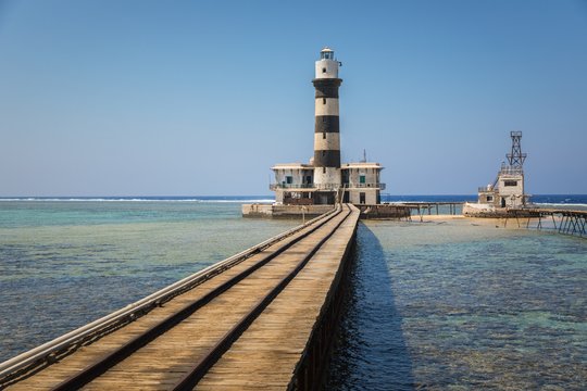 Long pier with lighthouse at the end