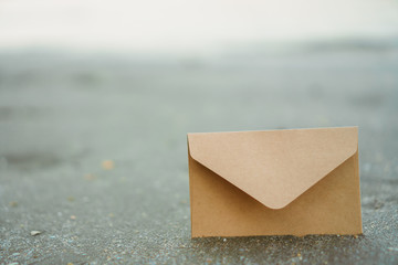 many od envelope imply for sending mail on sand texture background.
