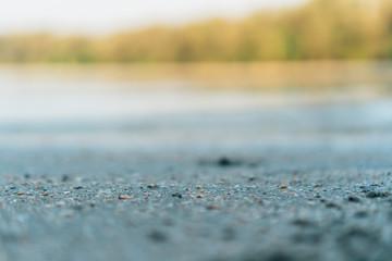 Fototapeta premium Copy space of grey sand and blue color summer beach background.