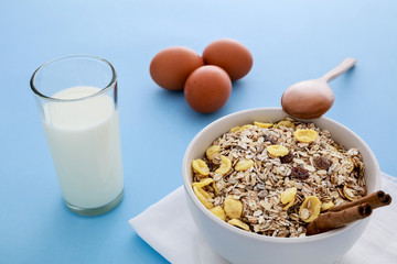 Healthy breakfast with muesli, raisins and cinnamon.