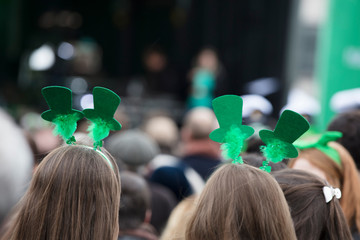 People wearing St Patricks day headbands at an st patrick's day event