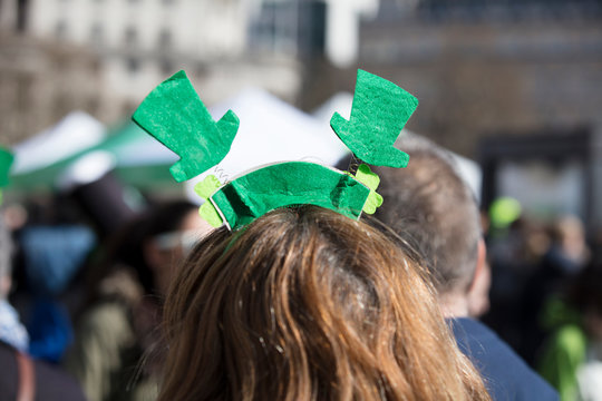 People wearing St Patricks day headbands at an st patrick's day event