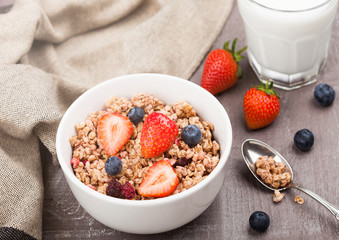 Bowl of healthy cereal granola with strawberries