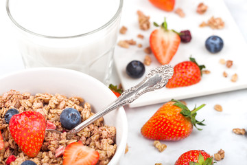 Bowl of healthy cereal granola with strawberries