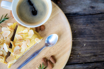 Cake and coffee cup on tray.