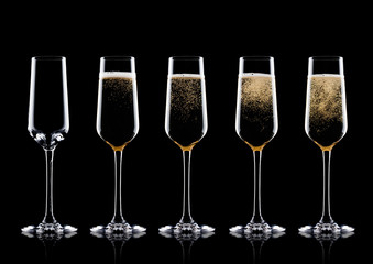 Elegant glasses of yellow champagne with bubbles