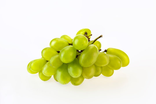 Green grapes on a white background have a sweet and sour taste, making a lot of food and drinks and very tasty.(clipping path)