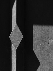 closeup black and white wood door with light and shadow