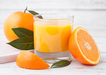 Glass of organic fresh orange juice with fruits