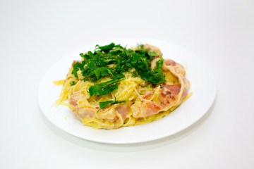 Pasta Carbonara. Cooking at home. Spaghetti with bacon, herbs and Parmesan cheese. Pasta Carbonara on a white background. Italian food concept.