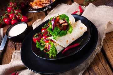 Tasty wraps filled with pulled pork and salad