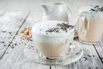 Tea latte, Earl Grey Hot London Fog Tea Drink with Foamed Milk, wooden background copy space