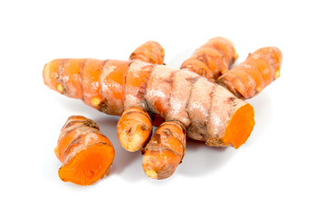 Close up of turmeric roots isolated on white background. Pile and cut turmeric root
