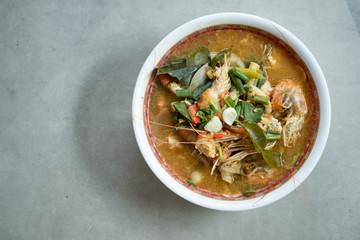 Tom Yum Goong or spicy tom yum soup with prawns shrimps
