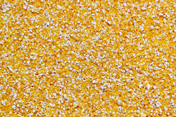 Crushed grains of corn (lat. Zéa máys), top view, close-up. Healthy, natural food.