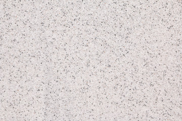 The texture of white and grey stone crumb. 