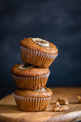 Healthy vegan oat muffins, apple and banana cakes on dark background. Close up, Bakery concept