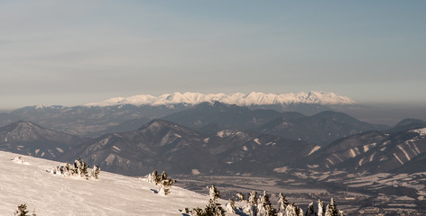 view to Tatra mountains from Martinske hole in Mala Fatra mountains in Slovakia during winter day with clear sky