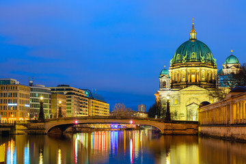 Berlin cathedral Berliner Dom in the evening twilight sunset with Spree river and reflections. Berlin, Germany.