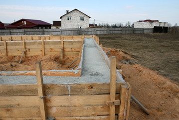 Building a house, pouring the foundation