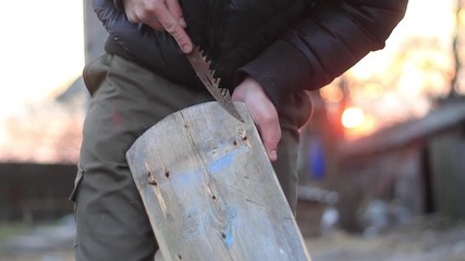 guy doing carving on the board with a knife