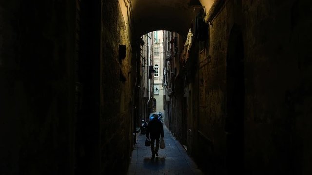 view from below towards the sky in the alleyways, typical narrow streets in the center of Genoa