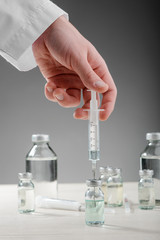 Medical worker filling the syringe