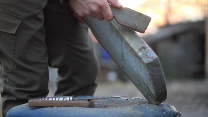 man grind the board with a metal brush
