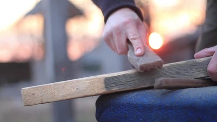 man polishing wood master board