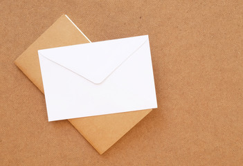 Book with envelope on wood