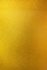 Vertical gold texture background. Vertical smooth gold texture surface