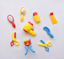 a set of children's toys for playing hairdresser and groomer to cut animals and people, scissors and a hairdryer with shampoo