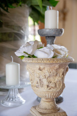 Fototapeta na wymiar Antique vase with white roses for the wedding