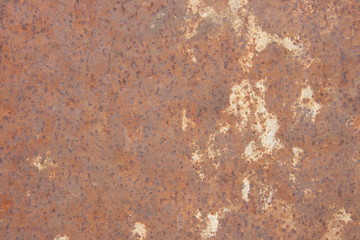 Rusty metal sheet with cement residue as background