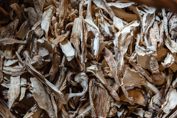 Top view of dried roots slices food background texture