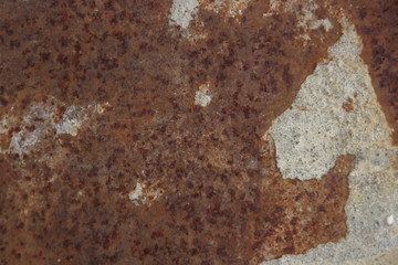 Rusty metal sheet with cement residue as background