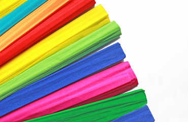 multi colored rolls of crepe paper fanned out