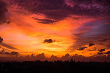 Beautiful sunset with yellow and violet sky at Bali, Indonesia.
