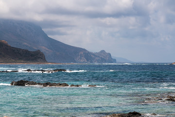 View of the coast. Sea. Mountains. Rocks. Clouds.