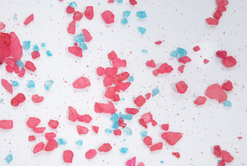 White background with blue and pink crystals.