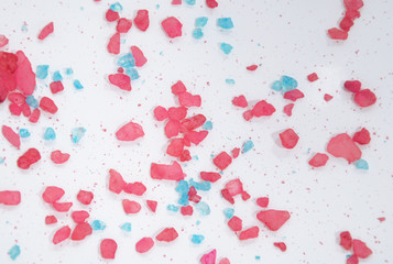 White background with blue and pink crystals.