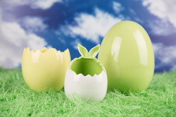 Easter, colorful eggs on green grass.