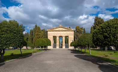 Obraz premium Old Roman Gate, entrance to the cemetery park (Cimitero Storico) in Lecce, Puglia, Italy. A region of Apulia