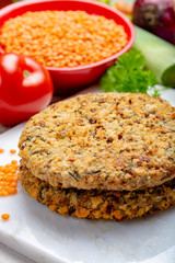 Tasty vegetarian food, raw burgers made from lentils legumes with vegetables ready for cooking